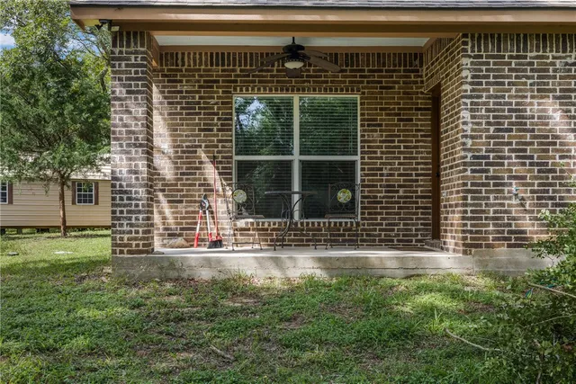 a view of outdoor space with deck and tree