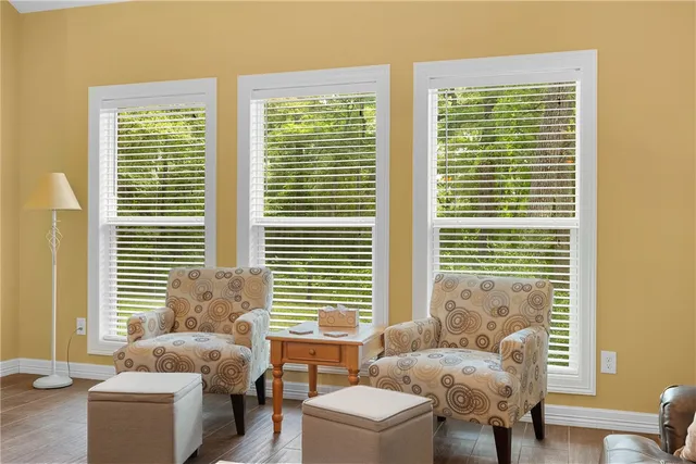 a living room with furniture and a window