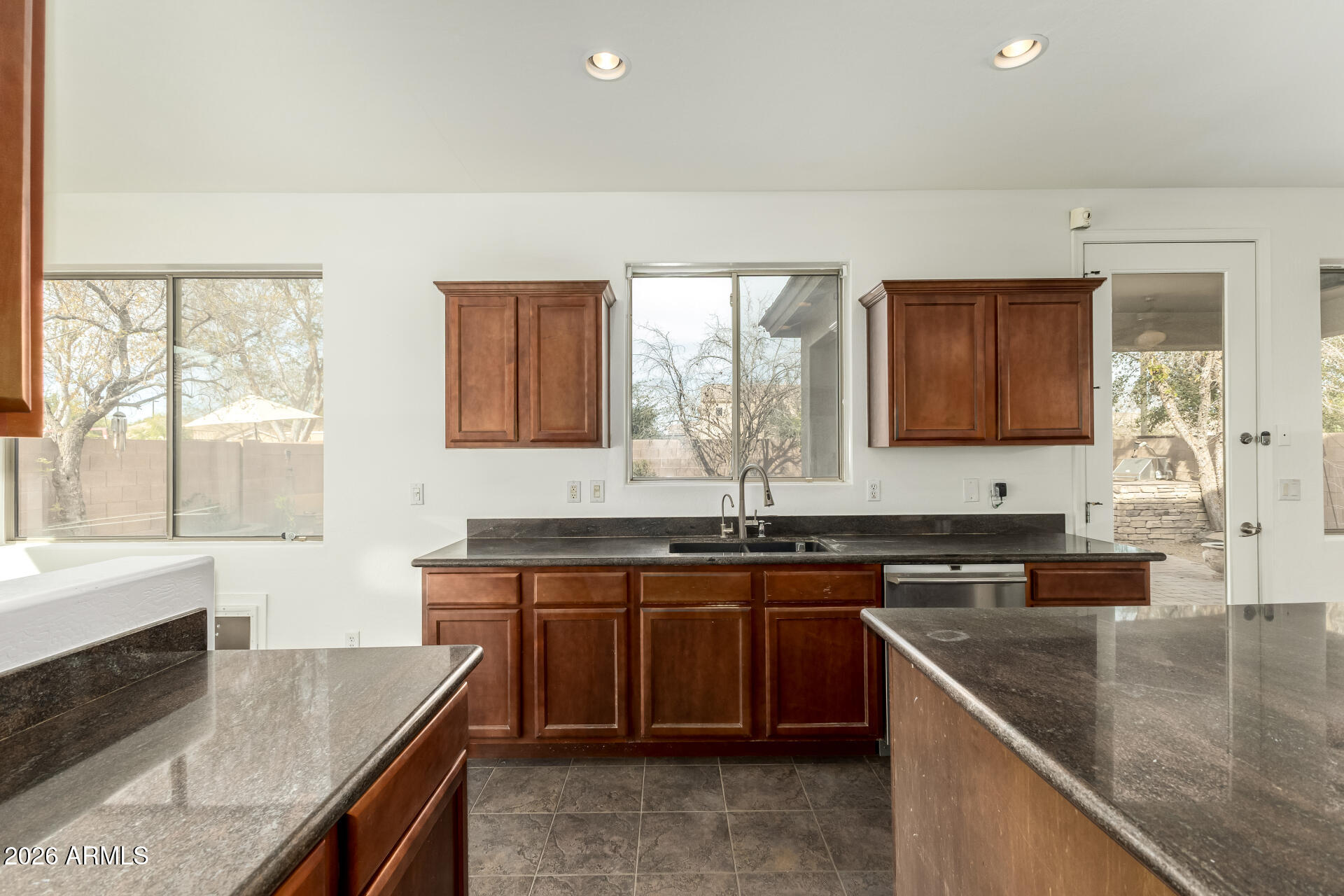 3628 East Janelle Way Gilbert, AZ 85298 - Photo 12 of 38 a kitchen with a sink stove top oven and microwave
