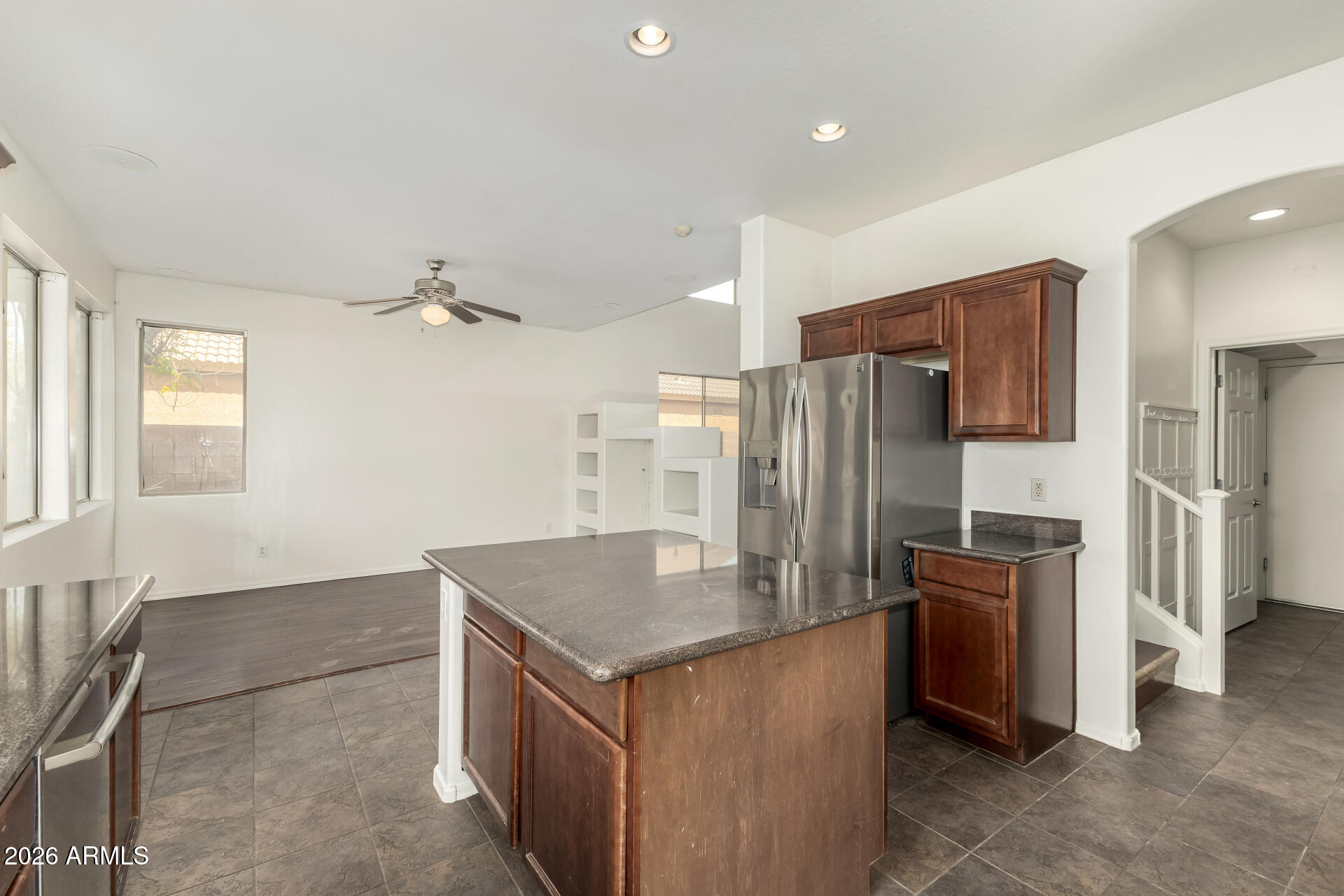 3628 East Janelle Way Gilbert, AZ 85298 - Photo 13 of 38 a kitchen with stainless steel appliances granite countertop a refrigerator and a sink
