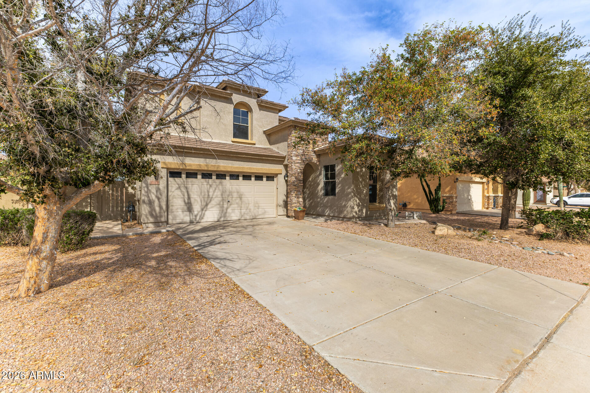 3628 East Janelle Way Gilbert, AZ 85298 - Photo 2 of 38 a front view of a building with trees