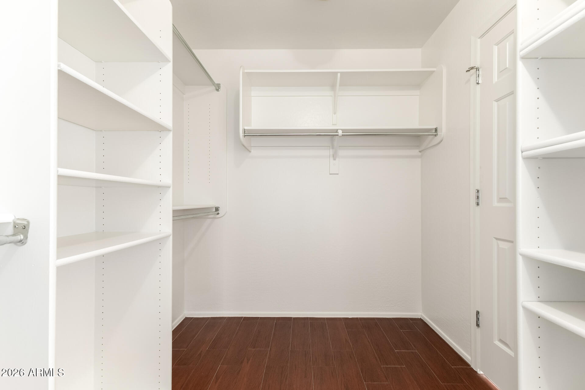3628 East Janelle Way Gilbert, AZ 85298 - Photo 21 of 38 a view of walk in closet with empty racks