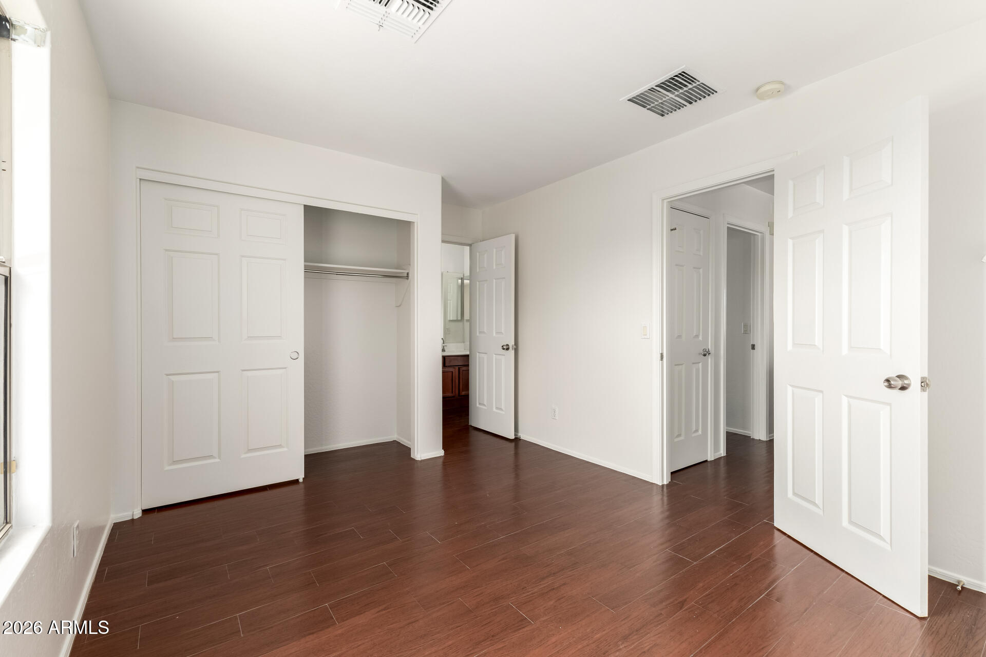 3628 East Janelle Way Gilbert, AZ 85298 - Photo 23 of 38 an empty room with wooden floor & windows