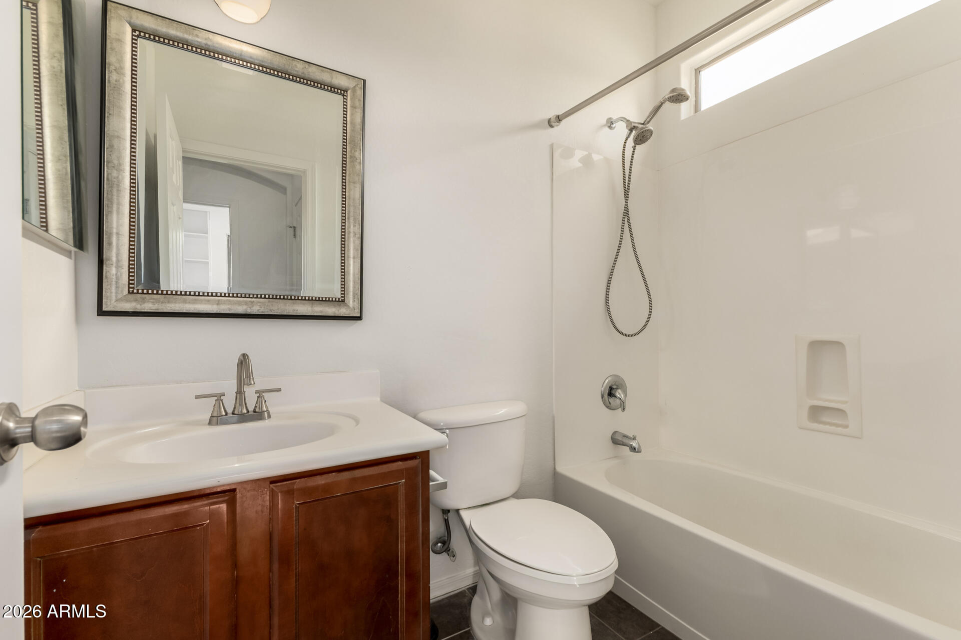 3628 East Janelle Way Gilbert, AZ 85298 - Photo 30 of 38 a bathroom with a sink vanity mirror and toilet
