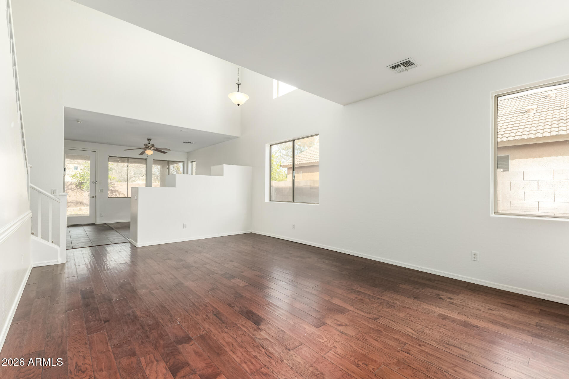 3628 East Janelle Way Gilbert, AZ 85298 - Photo 4 of 38 an empty room with wooden floor and windows