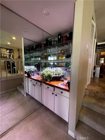 a kitchen with stainless steel appliances granite countertop a sink and cabinets