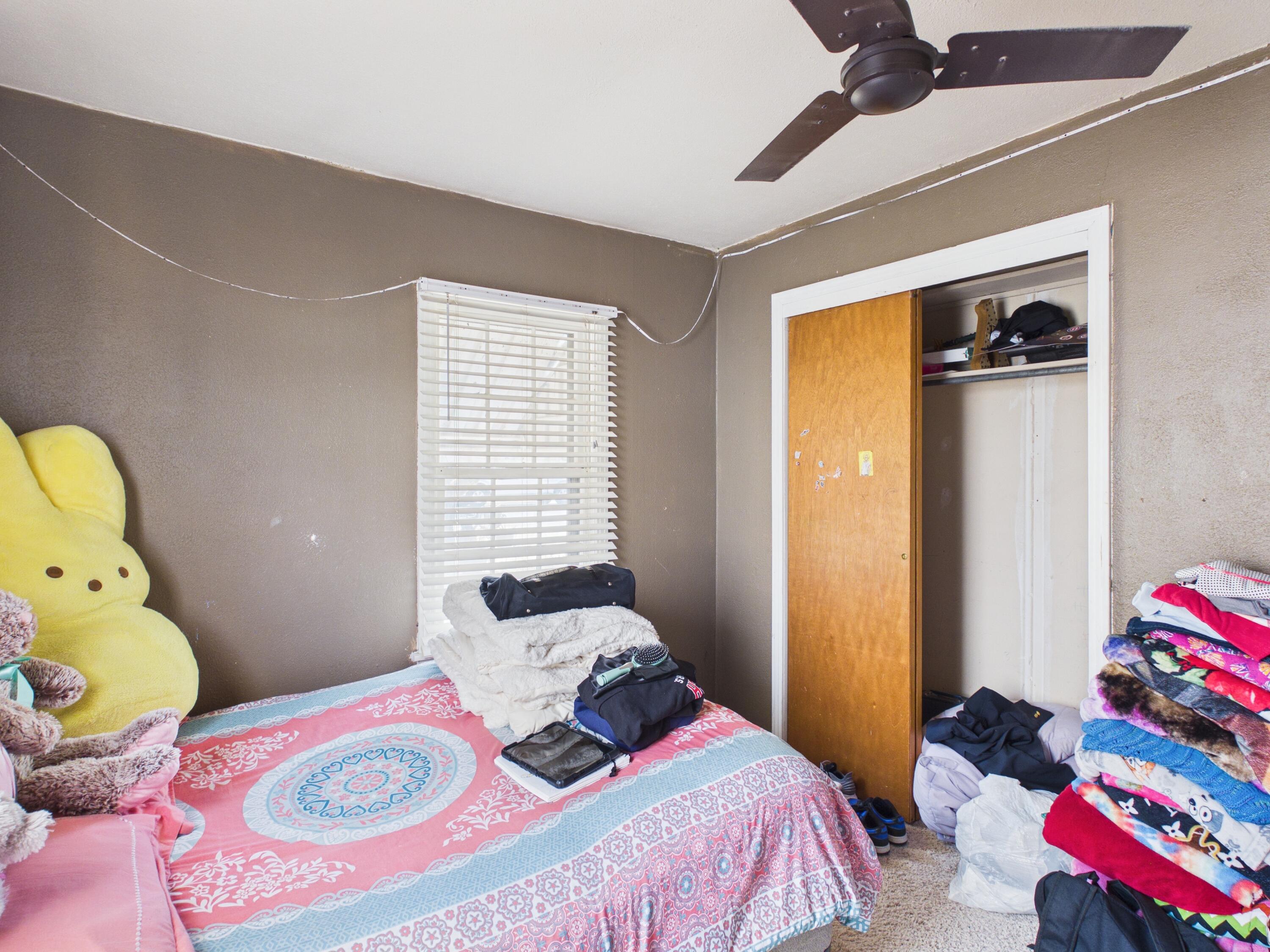 2016 41st Street Lubbock, TX 79412 - Photo 11 of 22 a bedroom with a bed and teddy bear on bed