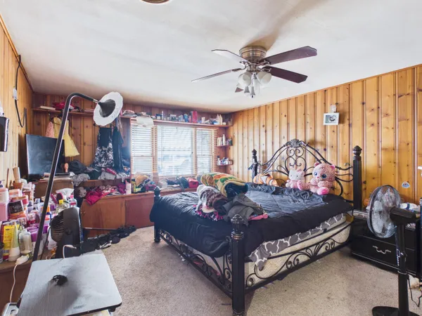 a room with lots of furniture and a window