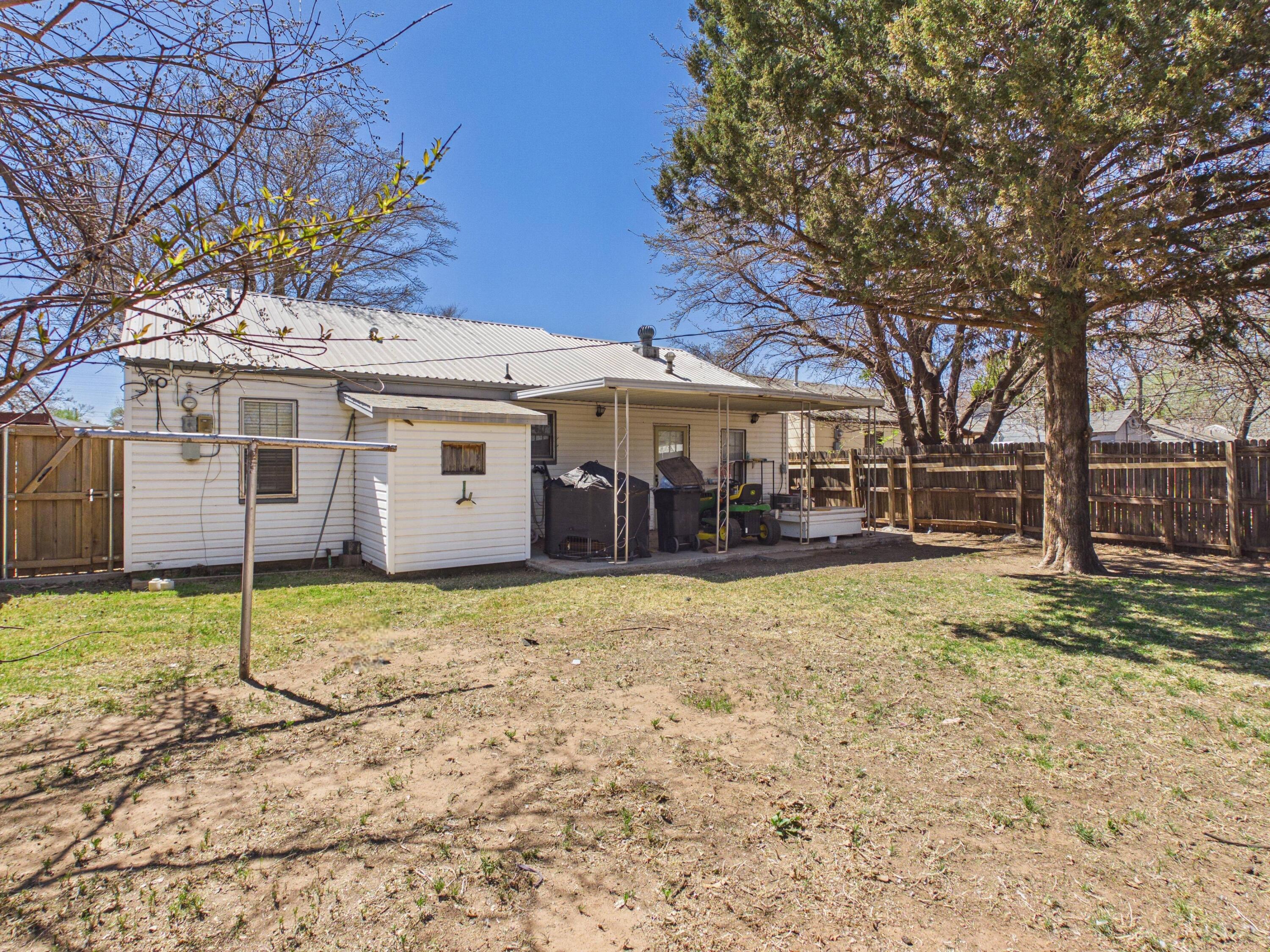 2016 41st Street Lubbock, TX 79412 - Photo 18 of 22 a view of a house with a yard covered in snow