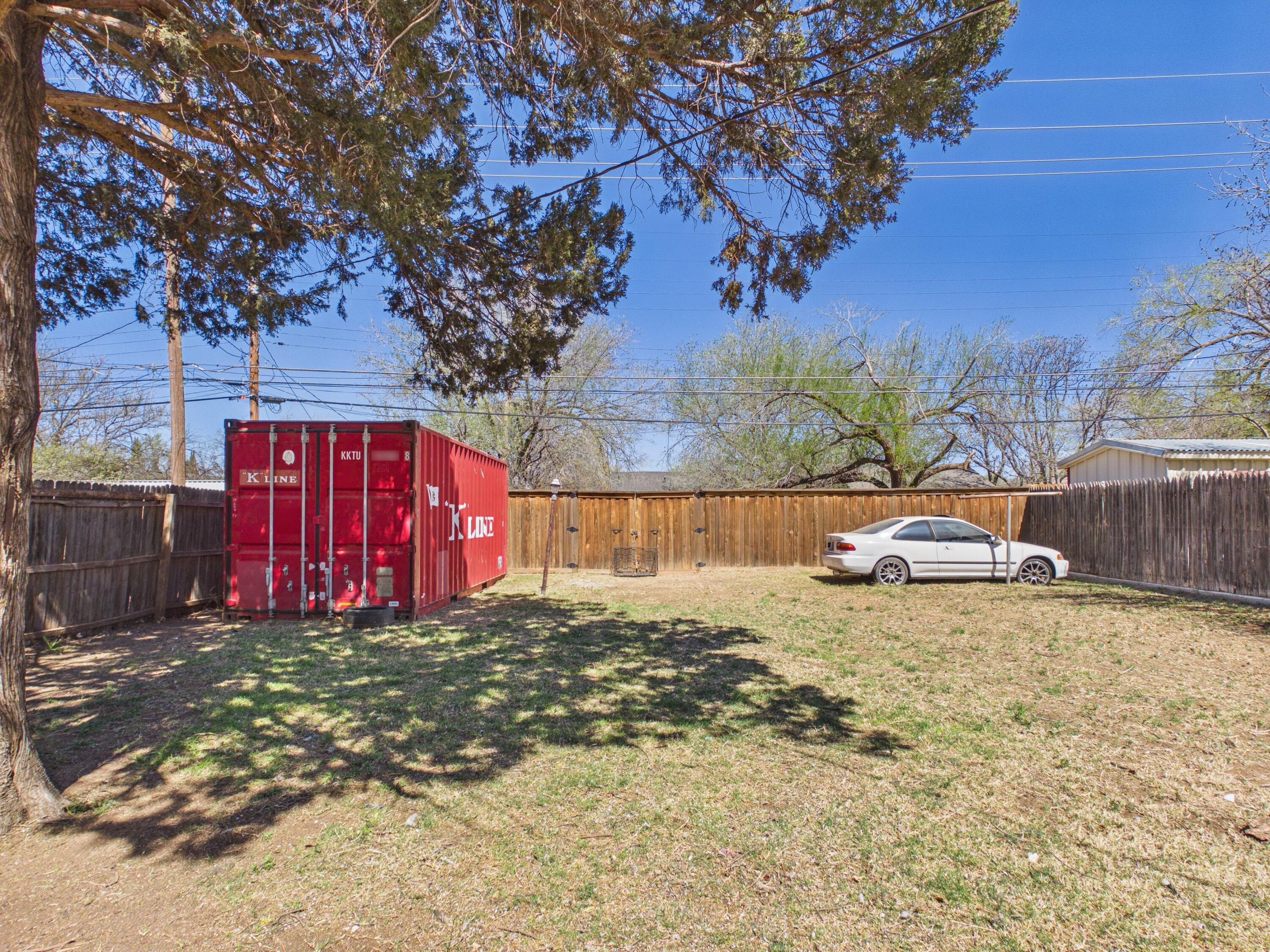 2016 41st Street Lubbock, TX 79412 - Photo 21 of 22 a view of a yard with large tree
