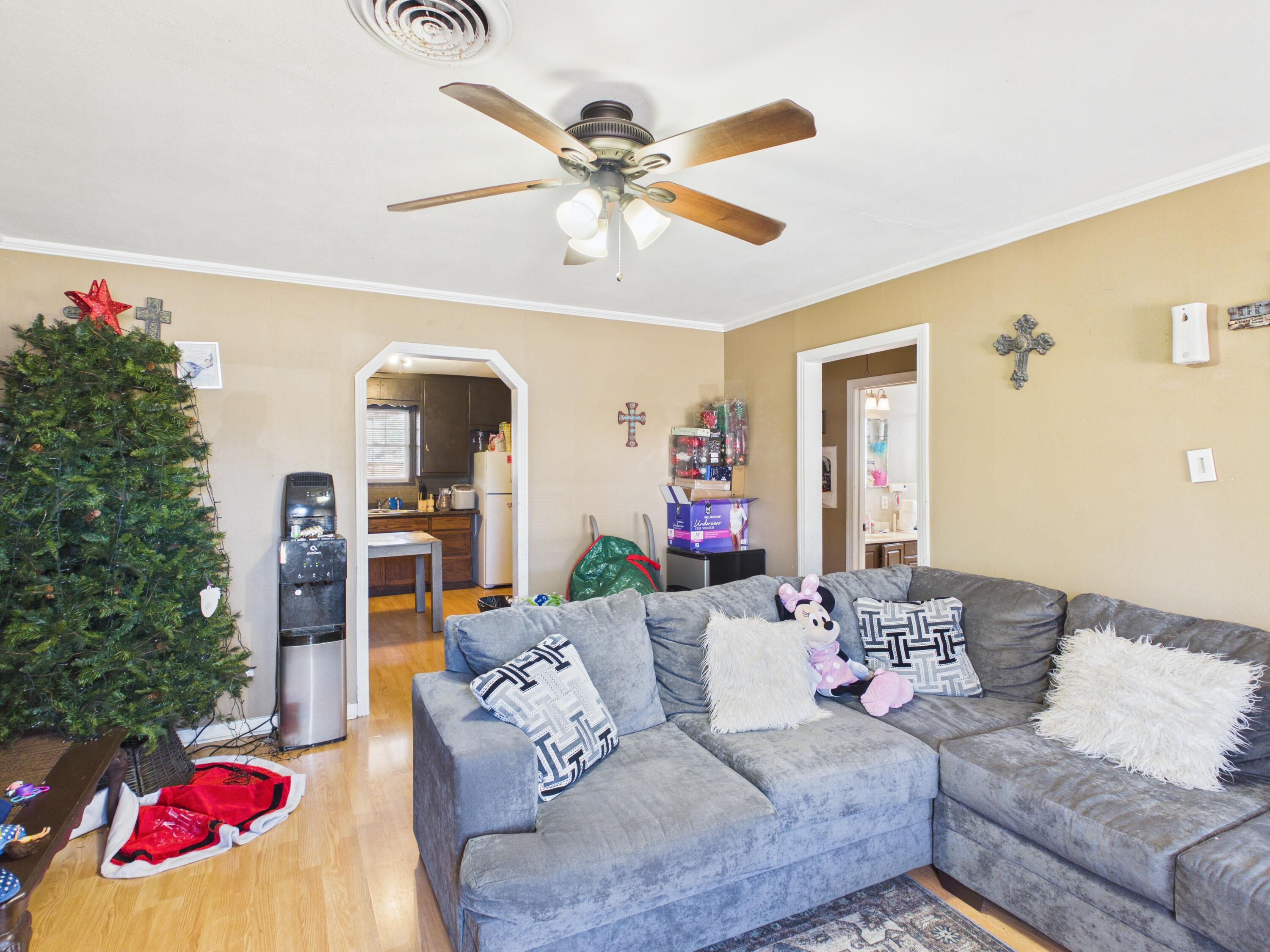2016 41st Street Lubbock, TX 79412 - Photo 4 of 22 a living room with furniture and a chandelier