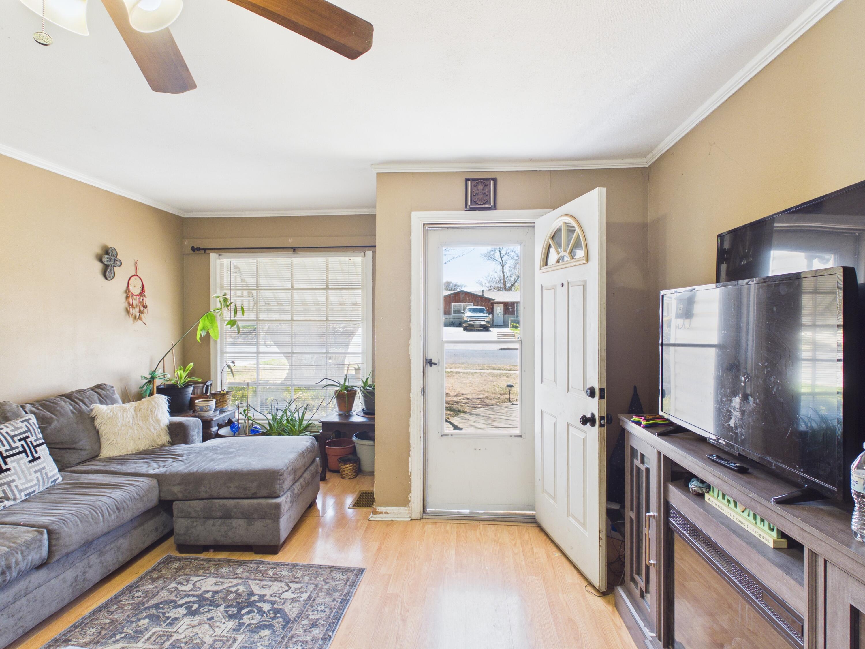 2016 41st Street Lubbock, TX 79412 - Photo 5 of 22 a living room with furniture and a flat screen tv