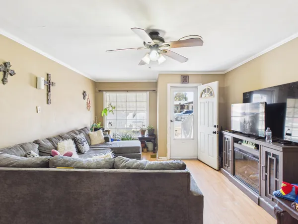 a living room with furniture and a flat screen tv