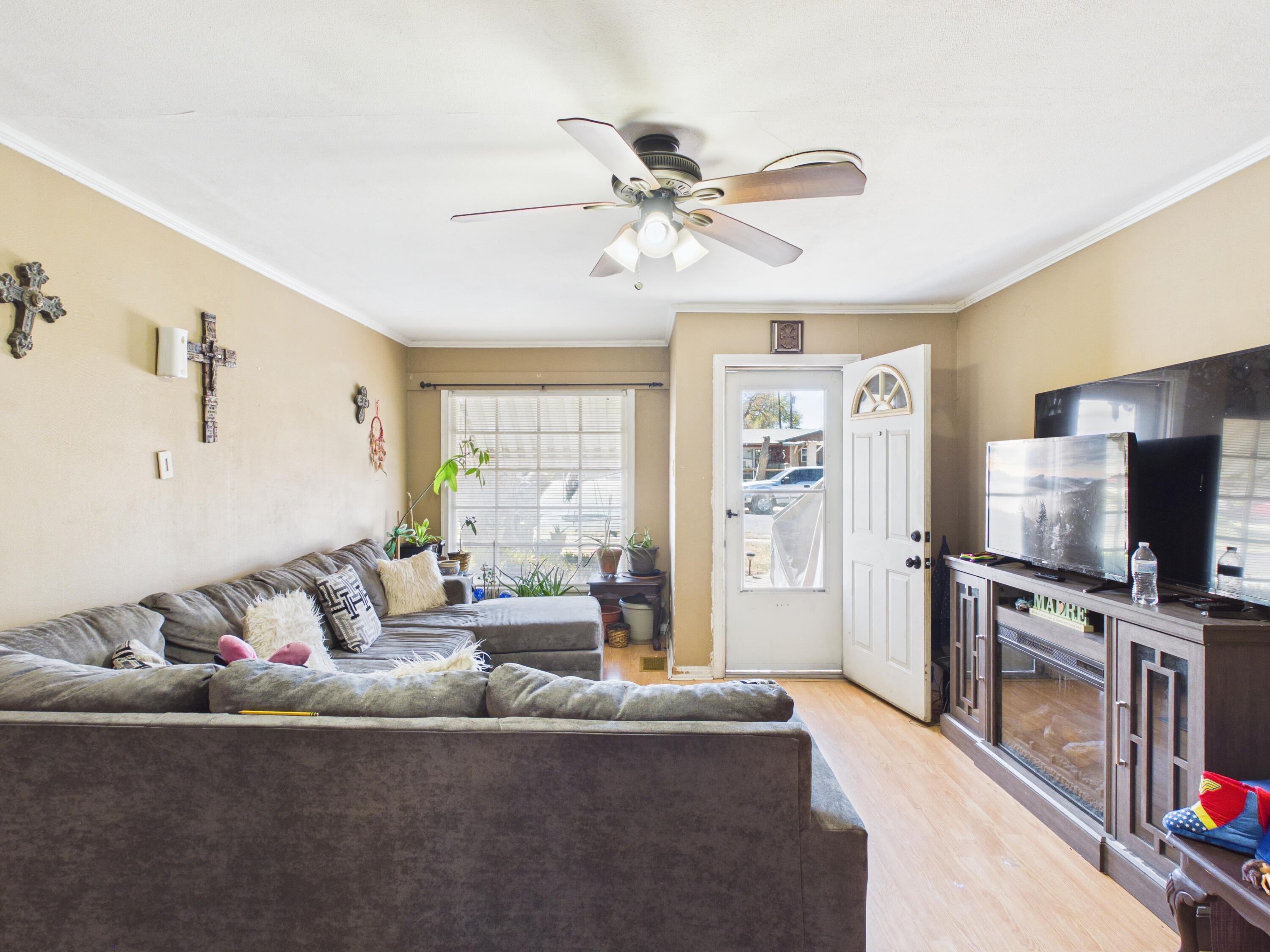2016 41st Street Lubbock, TX 79412 - Photo 6 of 22 a living room with furniture and a flat screen tv