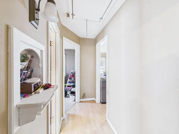 a bedroom with a bed a couch and a window