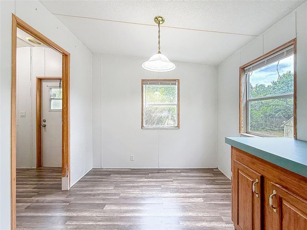 1819 Sinclair Hills Road Lutz, FL 33549 - Photo 24 of 60 a view of empty room with wooden floor and fan