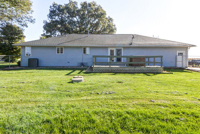 7687 Lakewood Road Weldon, IL 61882 - Photo 22 of 25 a house view with a sitting space and garden