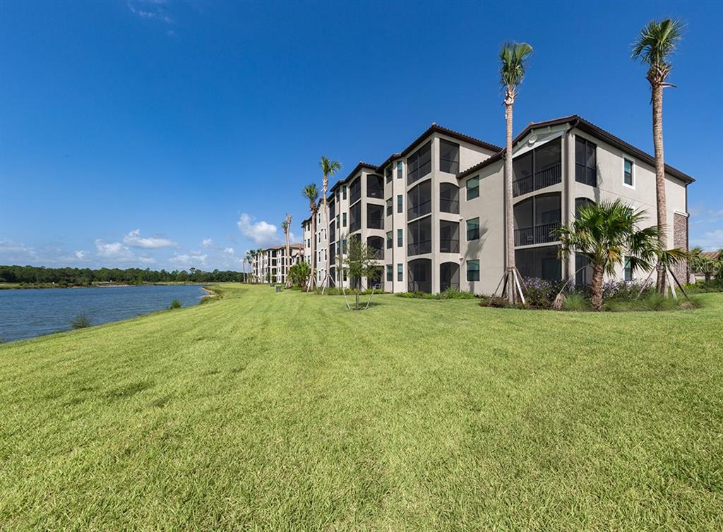 16904 Vardon Terrace, Unit 202 Lakewood Ranch, FL 34211 - Photo 29 of 30 a view of a house with backyard and garden