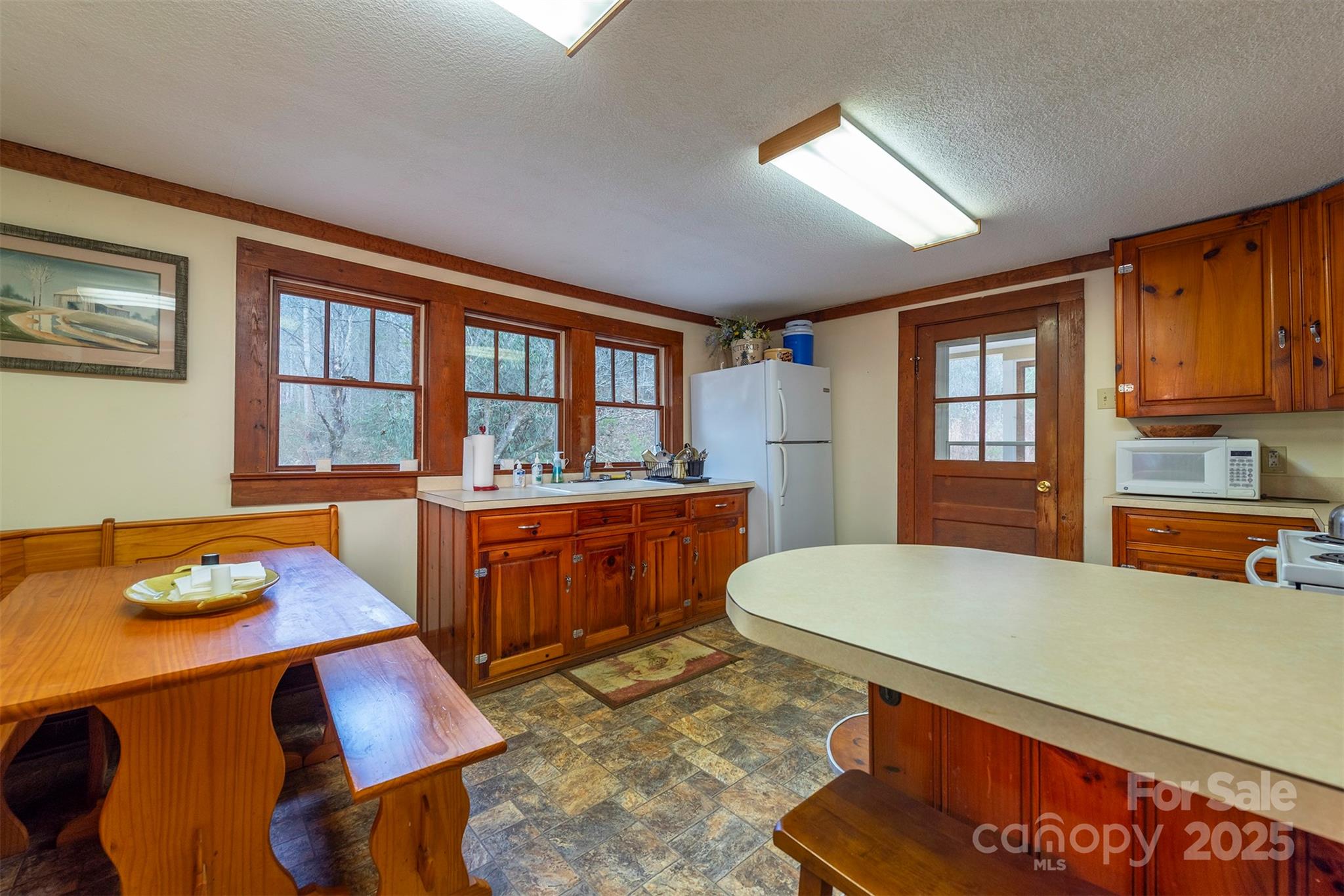 380 Buttercup Lane Marion, NC 28752 - Photo 30 of 48 a living room with furniture fireplace and dining table