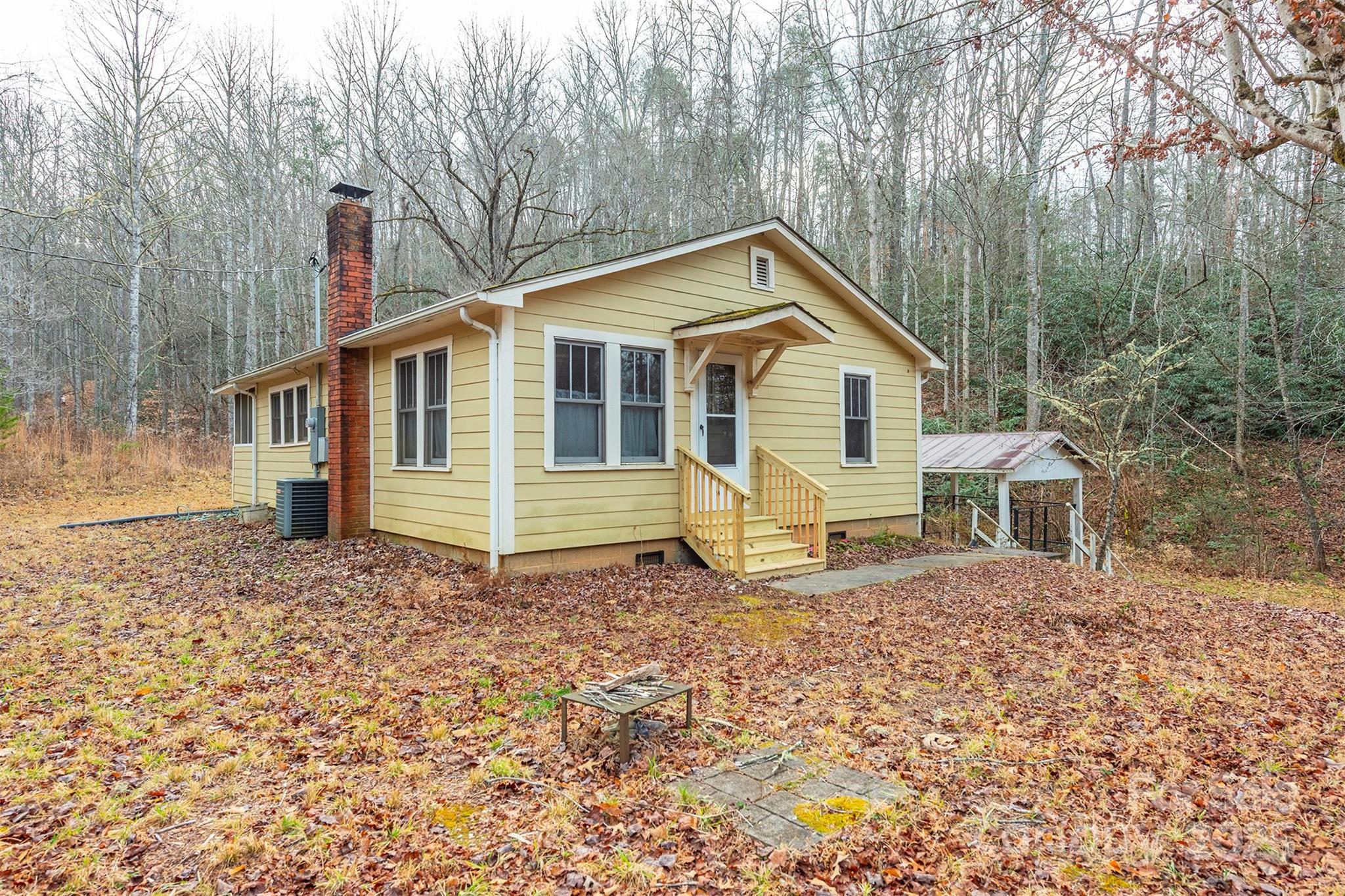 380 Buttercup Lane Marion, NC 28752 - Photo 3 of 48 a view of a house with a yard