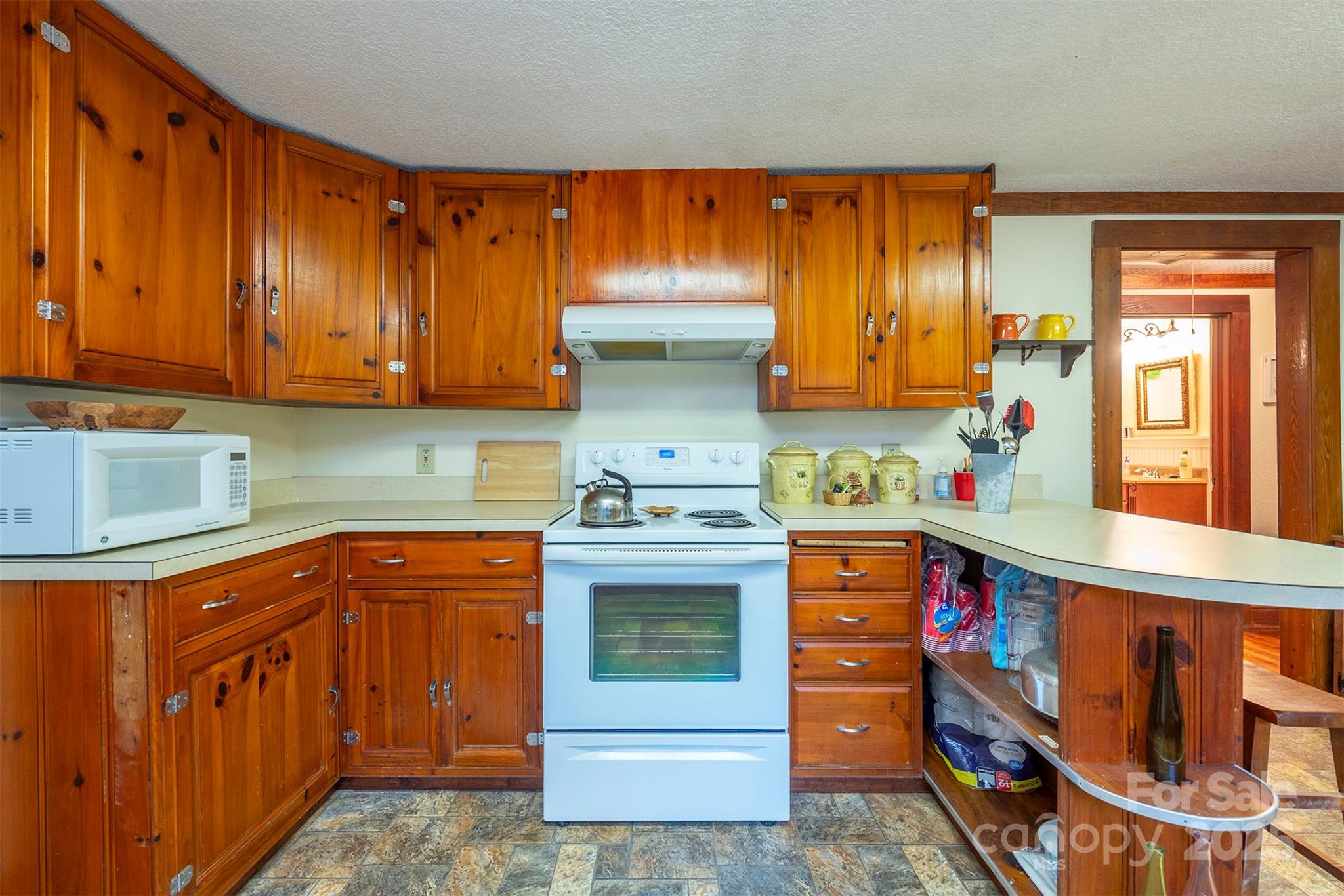 380 Buttercup Lane Marion, NC 28752 - Photo 34 of 48 a kitchen with stainless steel appliances granite countertop a stove and a cabinets
