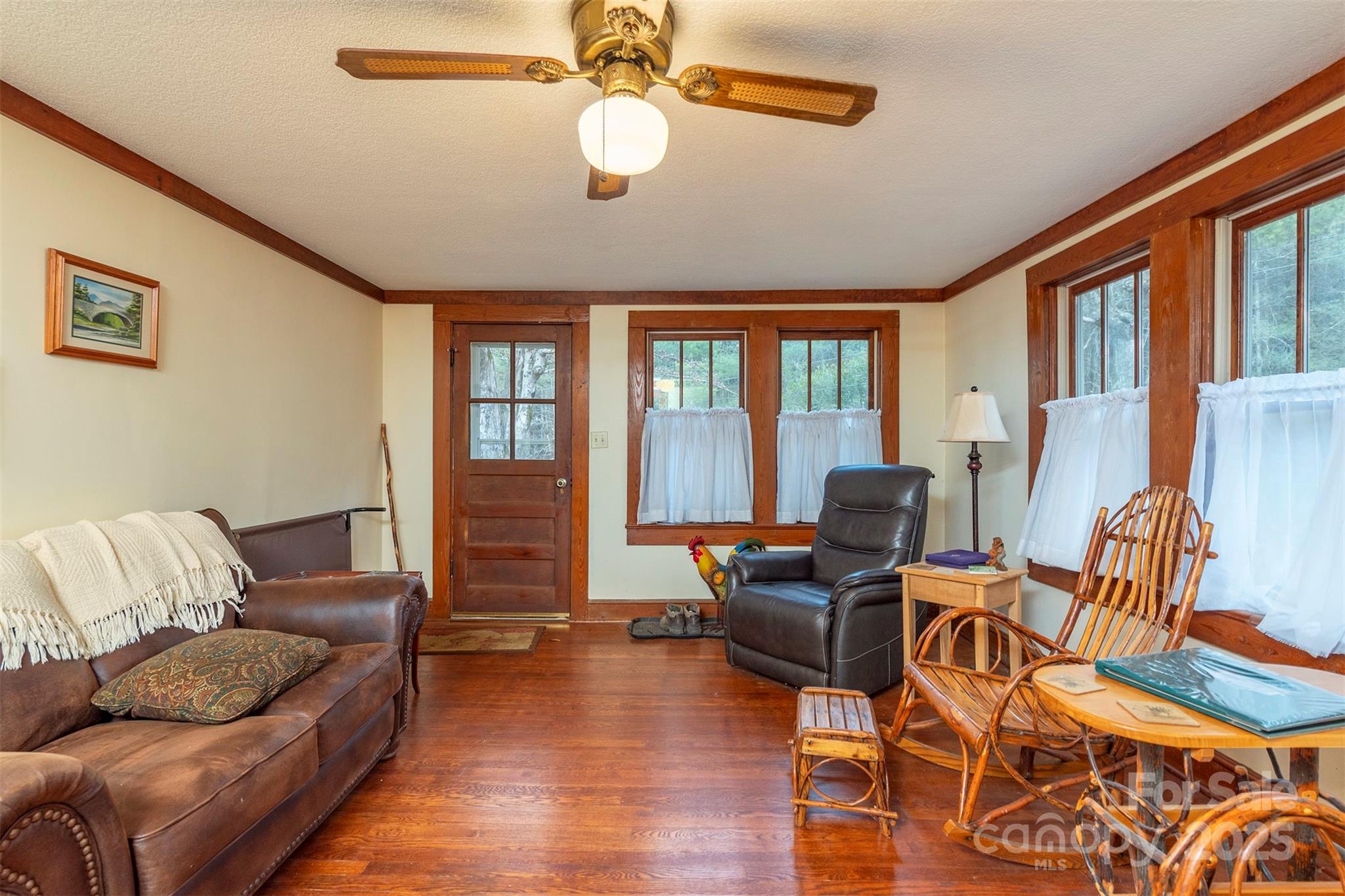 380 Buttercup Lane Marion, NC 28752 - Photo 36 of 48 a living room with furniture ceiling fan and a window