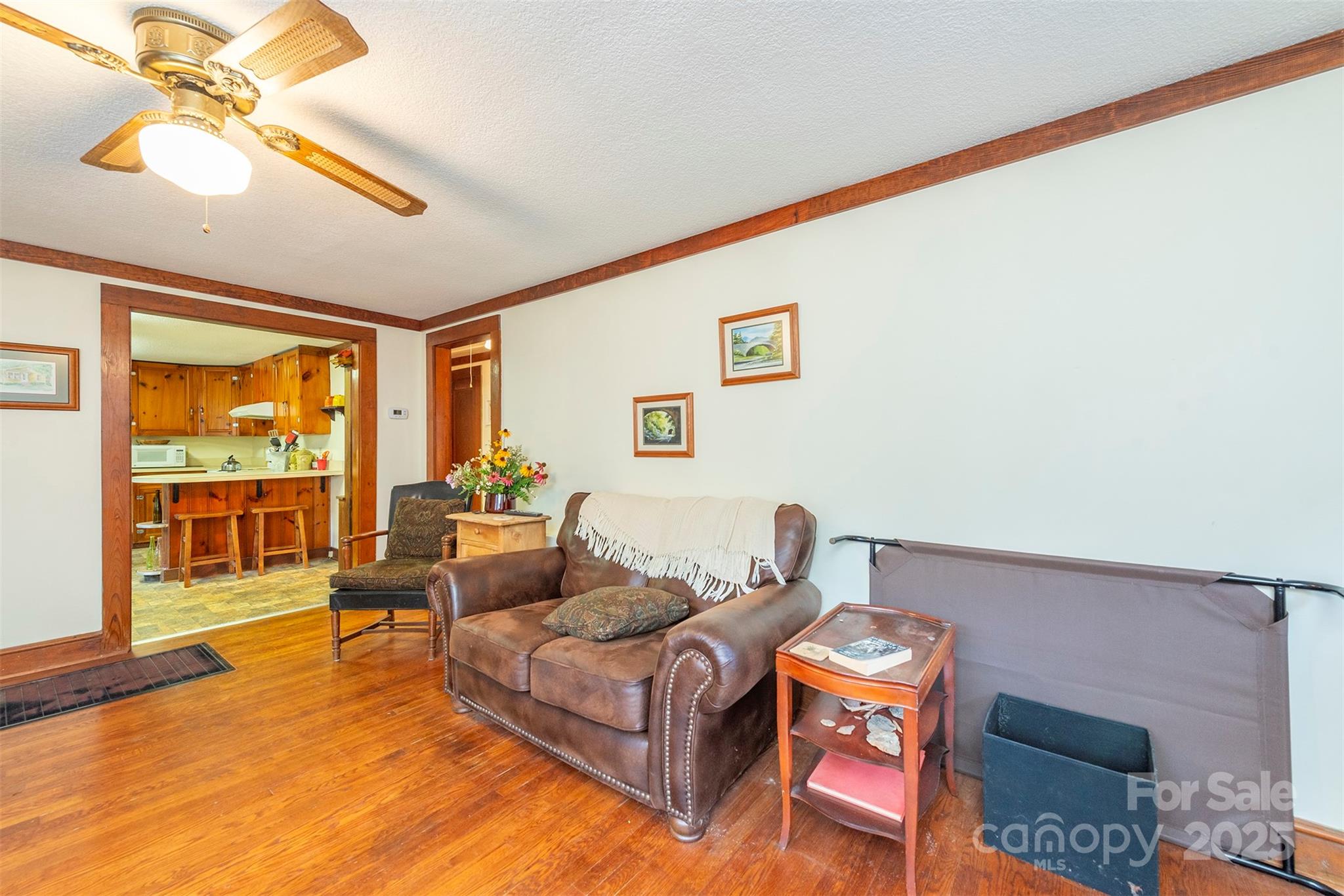 380 Buttercup Lane Marion, NC 28752 - Photo 38 of 48 a living room with furniture and a floor to ceiling window