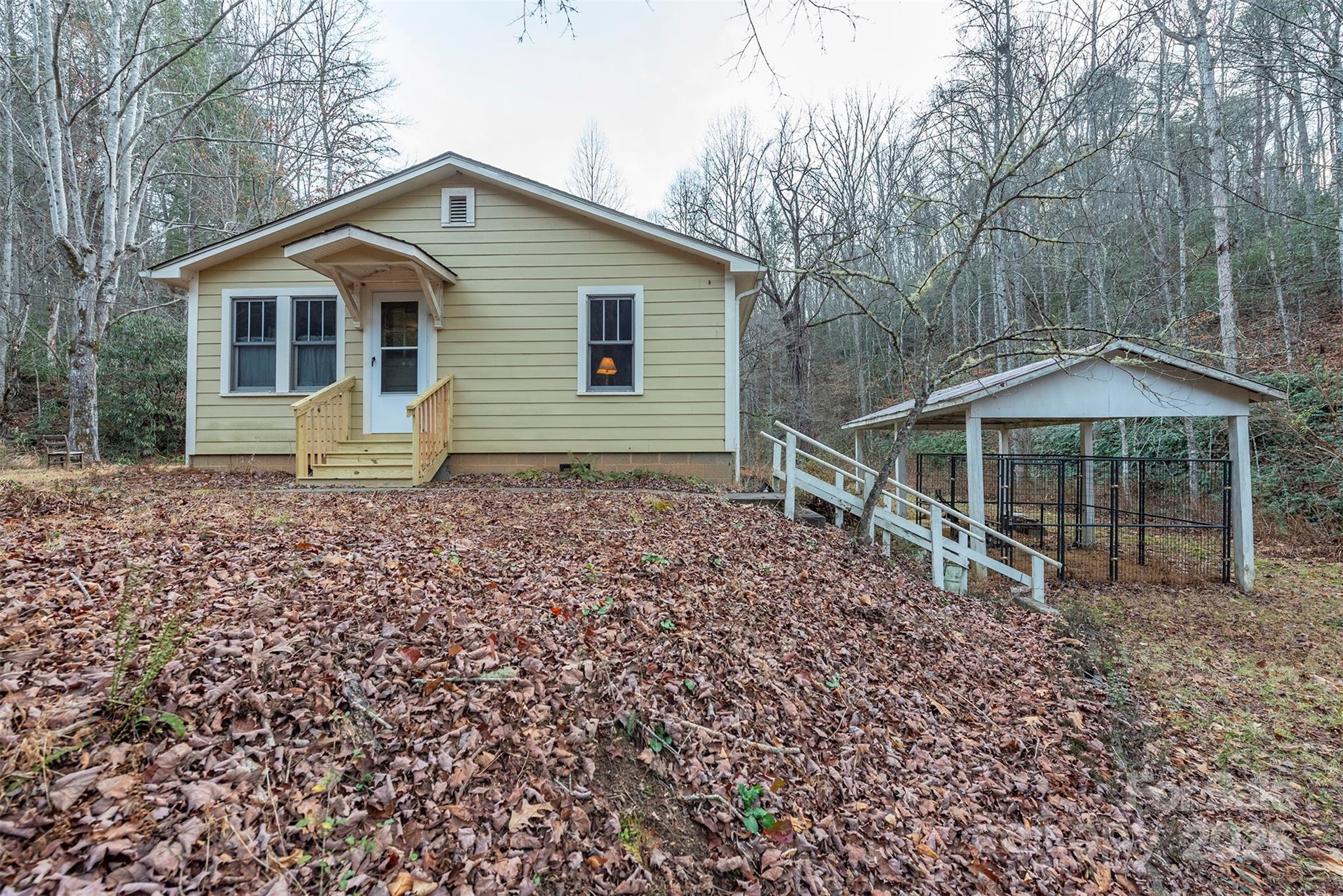 380 Buttercup Lane Marion, NC 28752 - Photo 4 of 48 a house with trees in the background