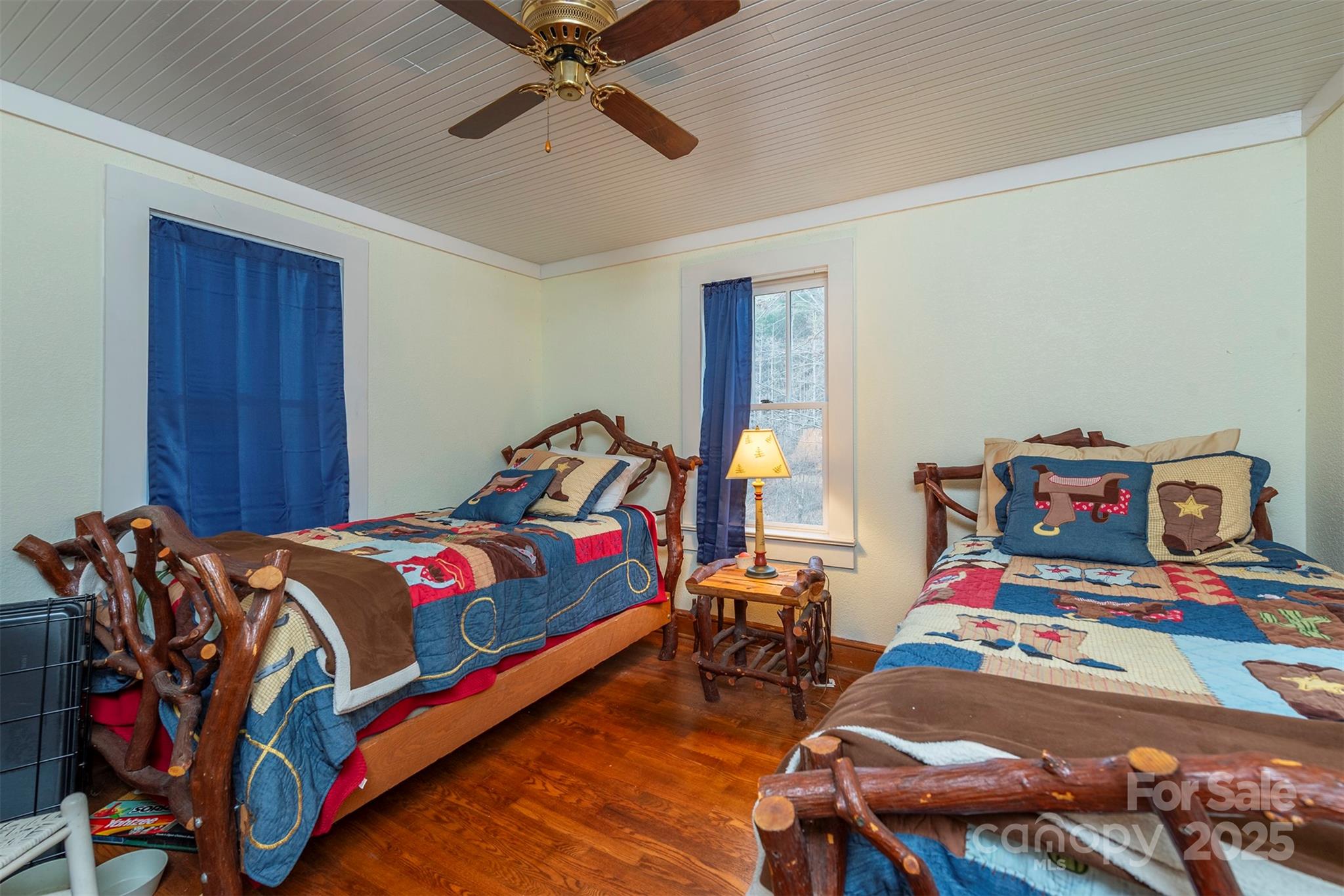 380 Buttercup Lane Marion, NC 28752 - Photo 41 of 48 a bedroom with bed and wooden floor