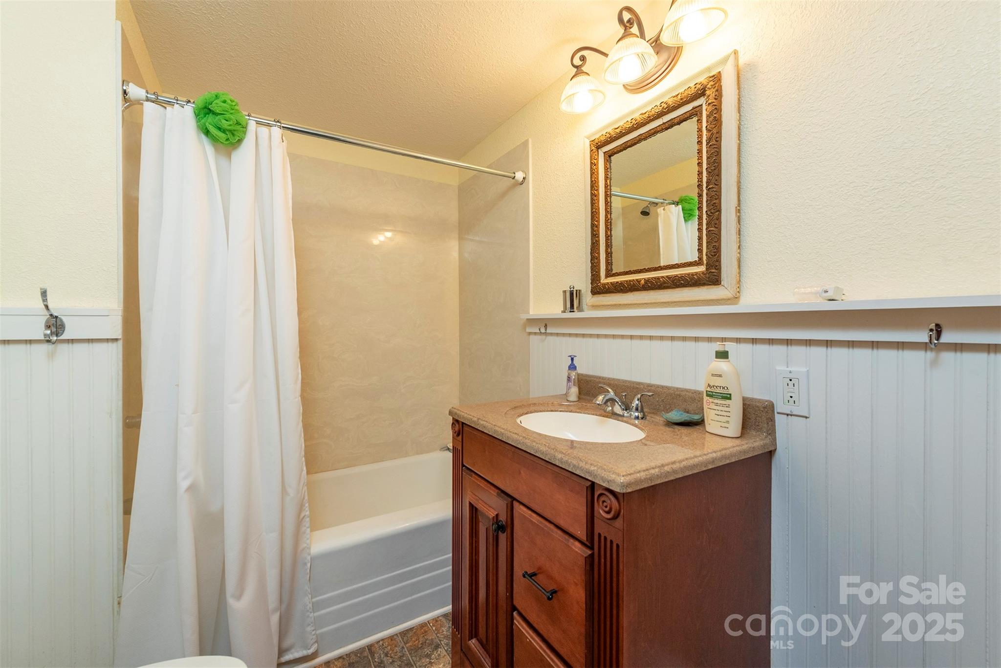 380 Buttercup Lane Marion, NC 28752 - Photo 43 of 48 a bathroom with a sink and a mirror