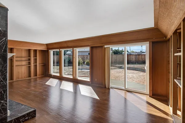 a view of an entryway with wooden floor