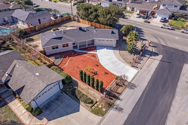 an aerial view of a house with outdoor space