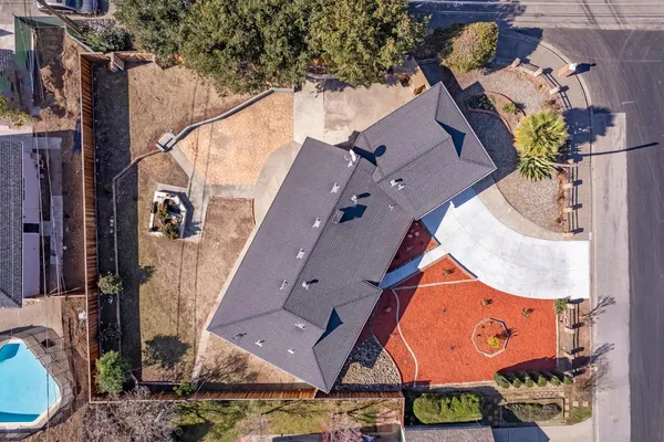 an aerial view of houses with yard