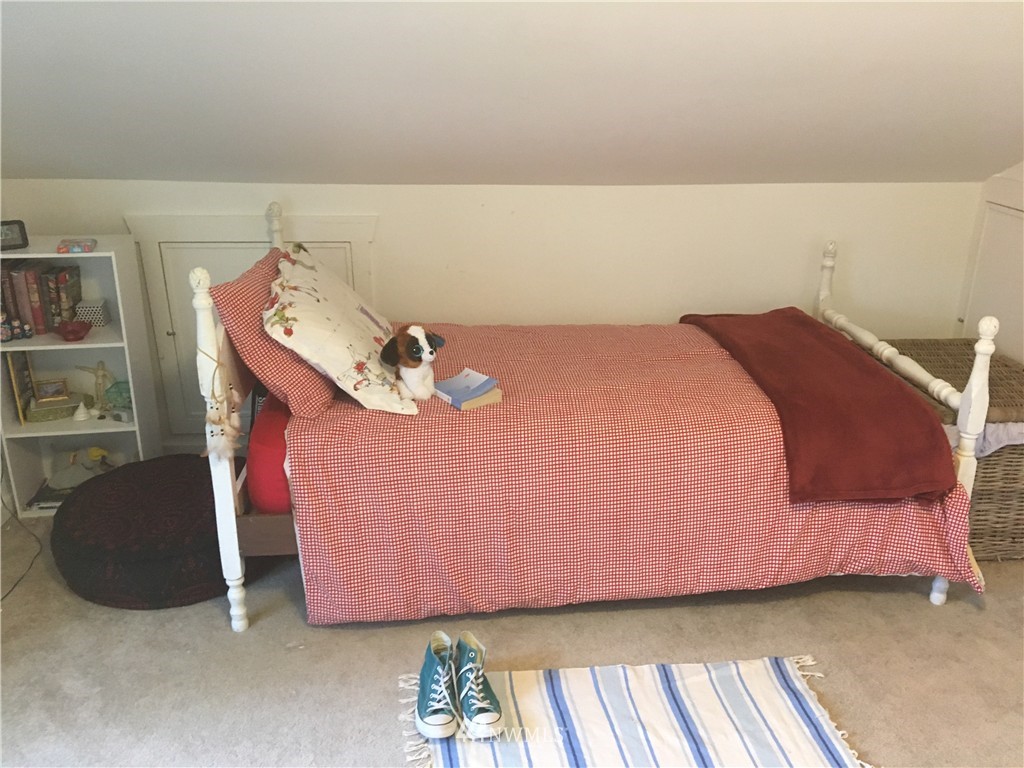 8725 Southwest Cemetery Road Vashon, WA 98070 - Photo 11 of 14 a bedroom with a bed and a couch