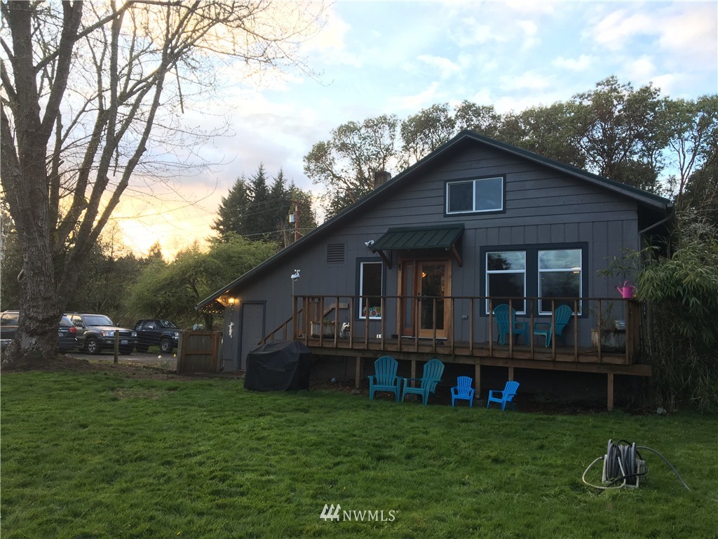 8725 Southwest Cemetery Road Vashon, WA 98070 - Photo 12 of 14 a front view of house with yard and green space