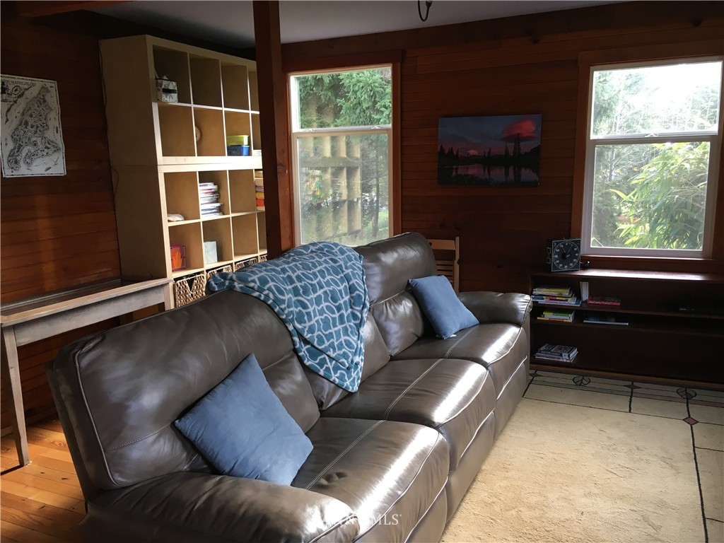 8725 Southwest Cemetery Road Vashon, WA 98070 - Photo 4 of 14 a living room with furniture and a window