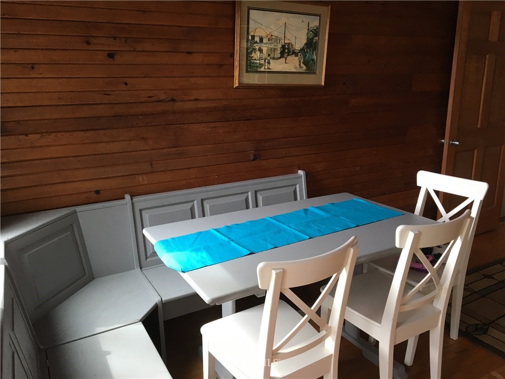 8725 Southwest Cemetery Road Vashon, WA 98070 - Photo 7 of 14 a view of a dining room with furniture and wooden floor