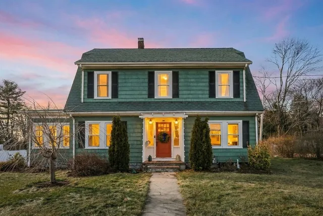 a front view of a house with garden