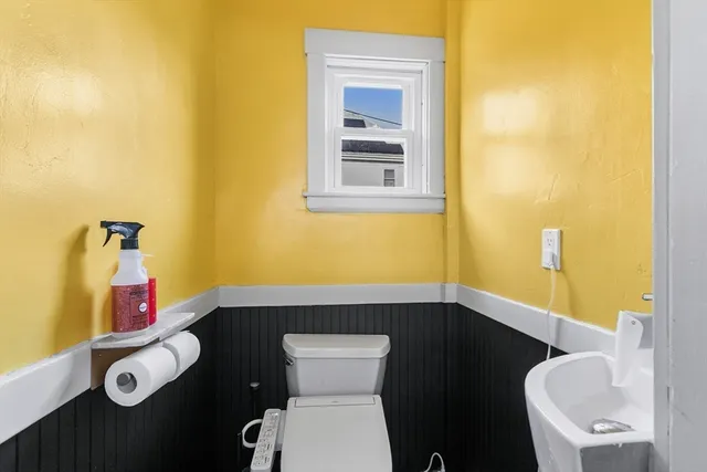 a bed room with a bed and a mirror