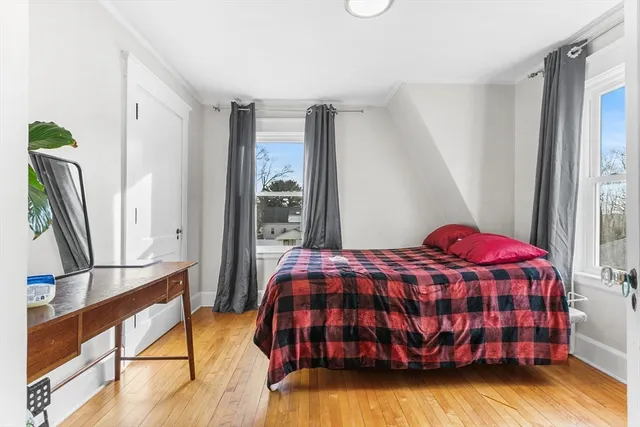 an aerial view of house with yard and mountain view in back