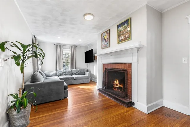a living room with furniture windows and a chandelier