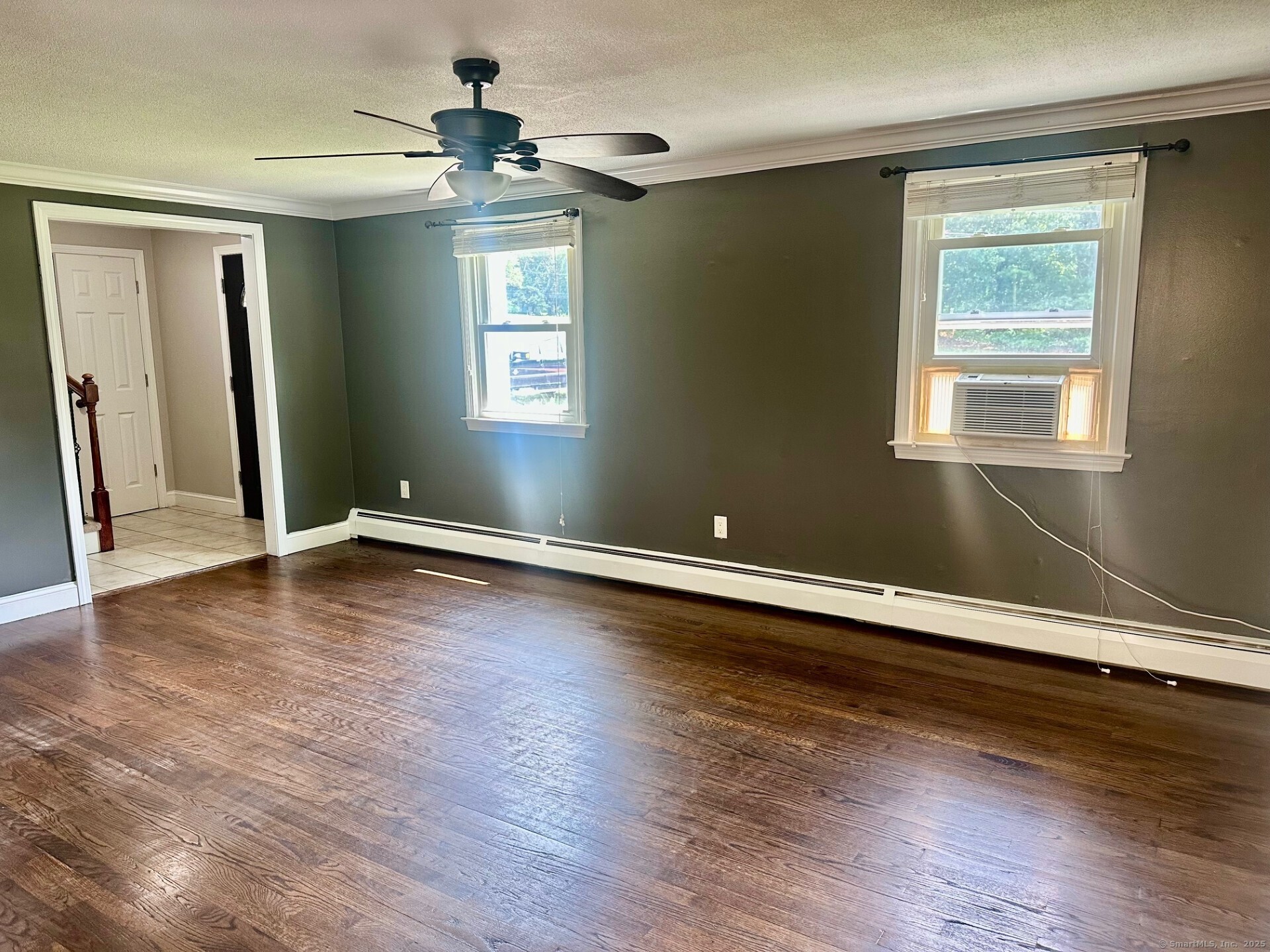 254 Sand Hill Road South Windsor, CT 06074 - Photo 6 of 20 a view of an empty room with wooden floor and a window
