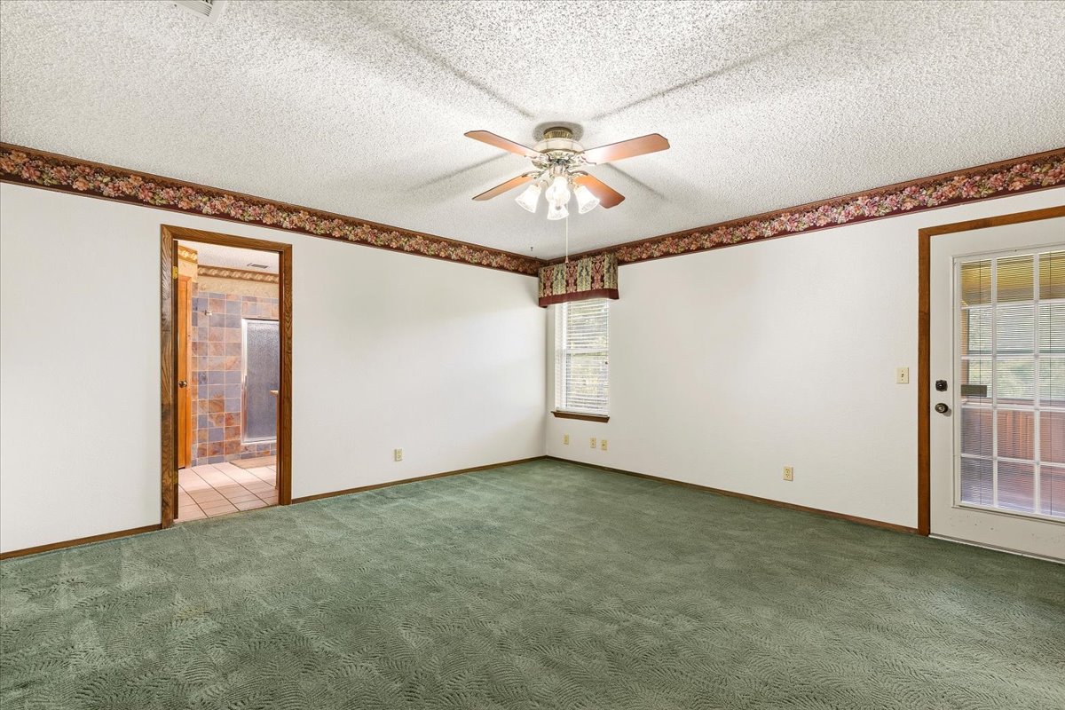 250 Hickory Drive Elgin, TX 78621 - Photo 14 of 37 an empty room with windows and fan