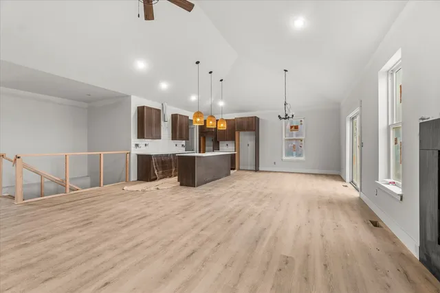 a view of a kitchen with a sink and a refrigerator