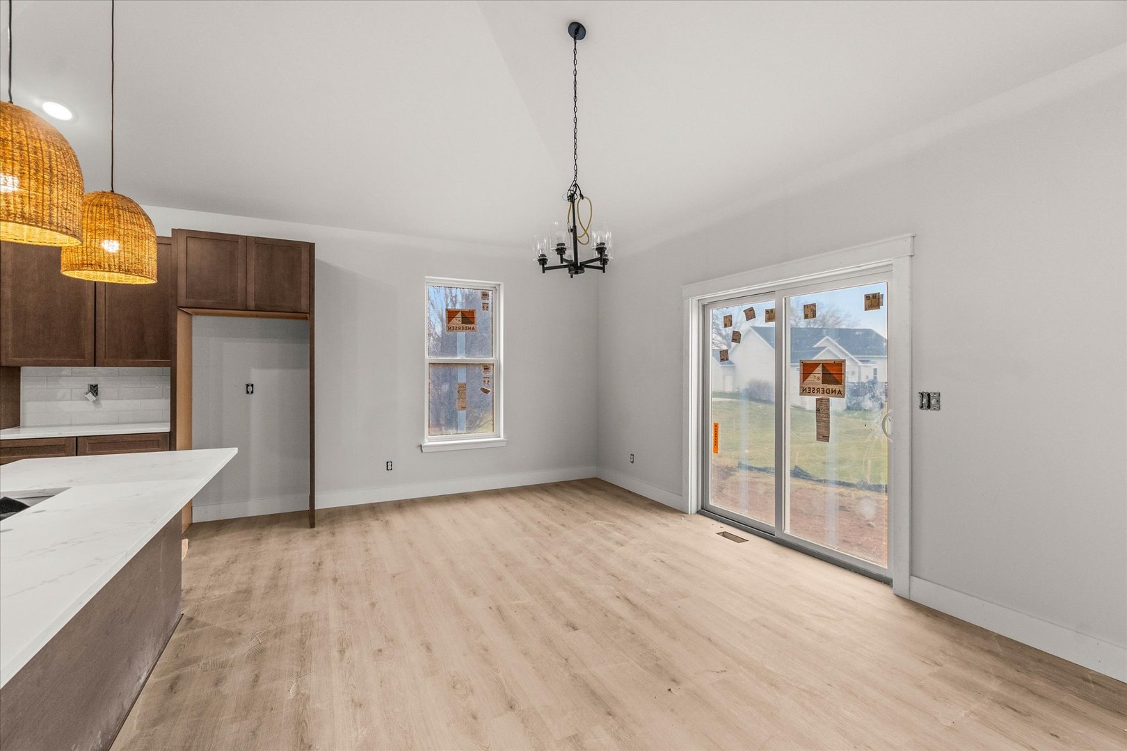 1417 Sandcastle Drive Sycamore, IL 60178 - Photo 5 of 9 a view of a room with wooden floor and a ceiling fan