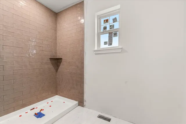 a bathroom with a bathtub and sink