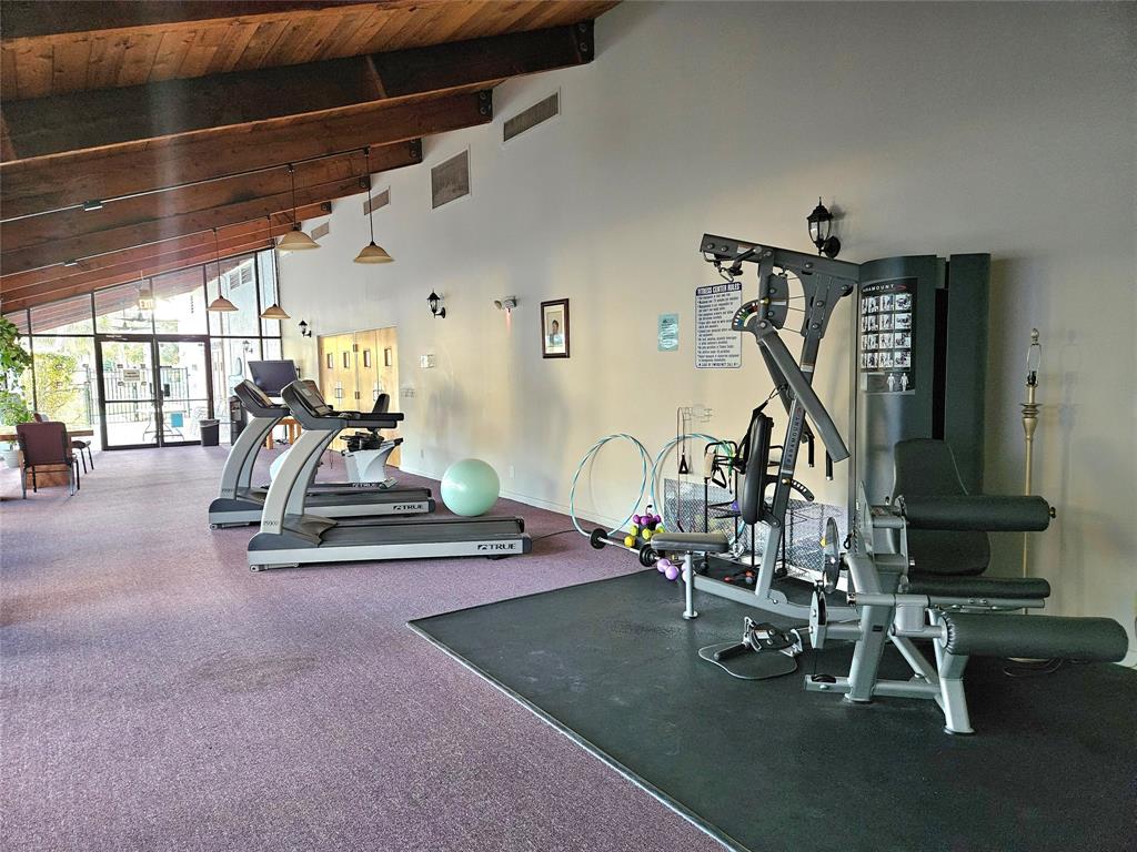 1460 Northwest 80th Avenue, Unit 101 Margate, FL 33063 - Photo 26 of 27 a view of a room with gym equipment
