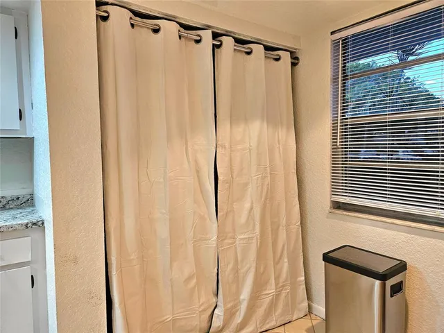 a view of a hallway with washer and dryer