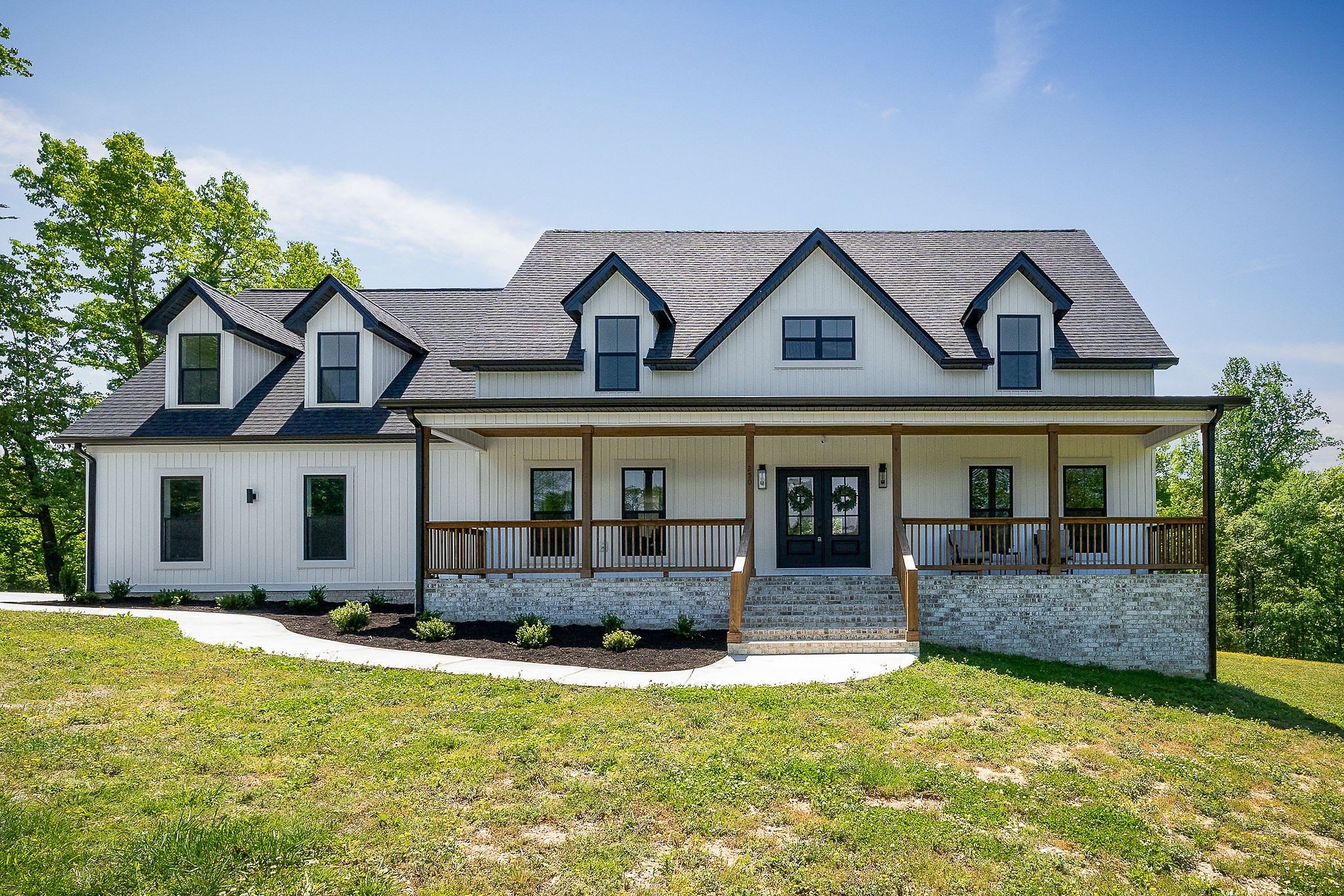 a front view of a house with a yard