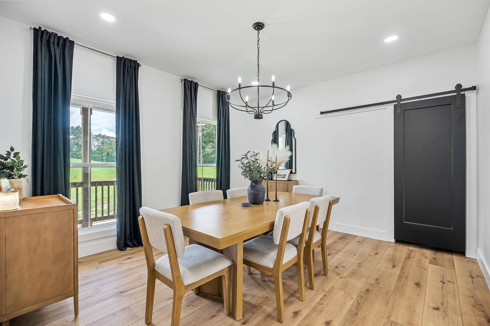 250 Dyer Ridge Road Baxter, TN 38544 - Photo 11 of 52 a dining room with furniture a chandelier and wooden floor